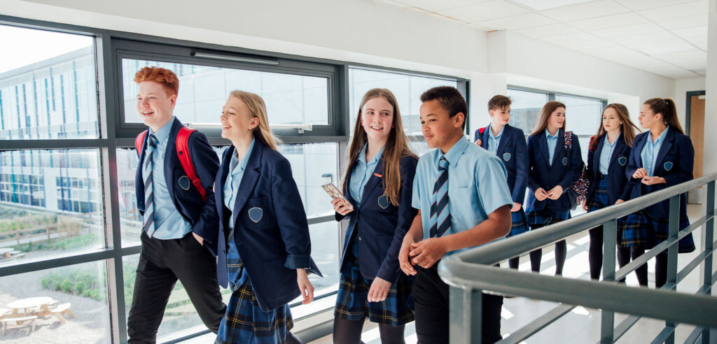 Teenagers at school walking and talking.