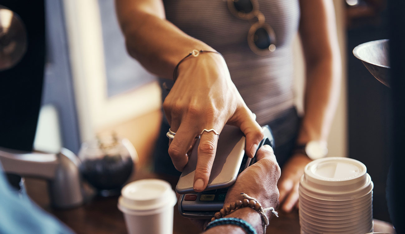 Customer tapping their phone to make a fast, secure payment.